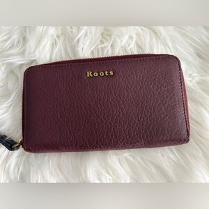 Roots Leather Zip around Clutch in Deep Burgundy and Navy